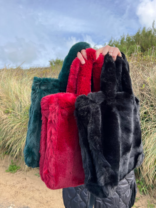 Furry bags in teal, berry and black