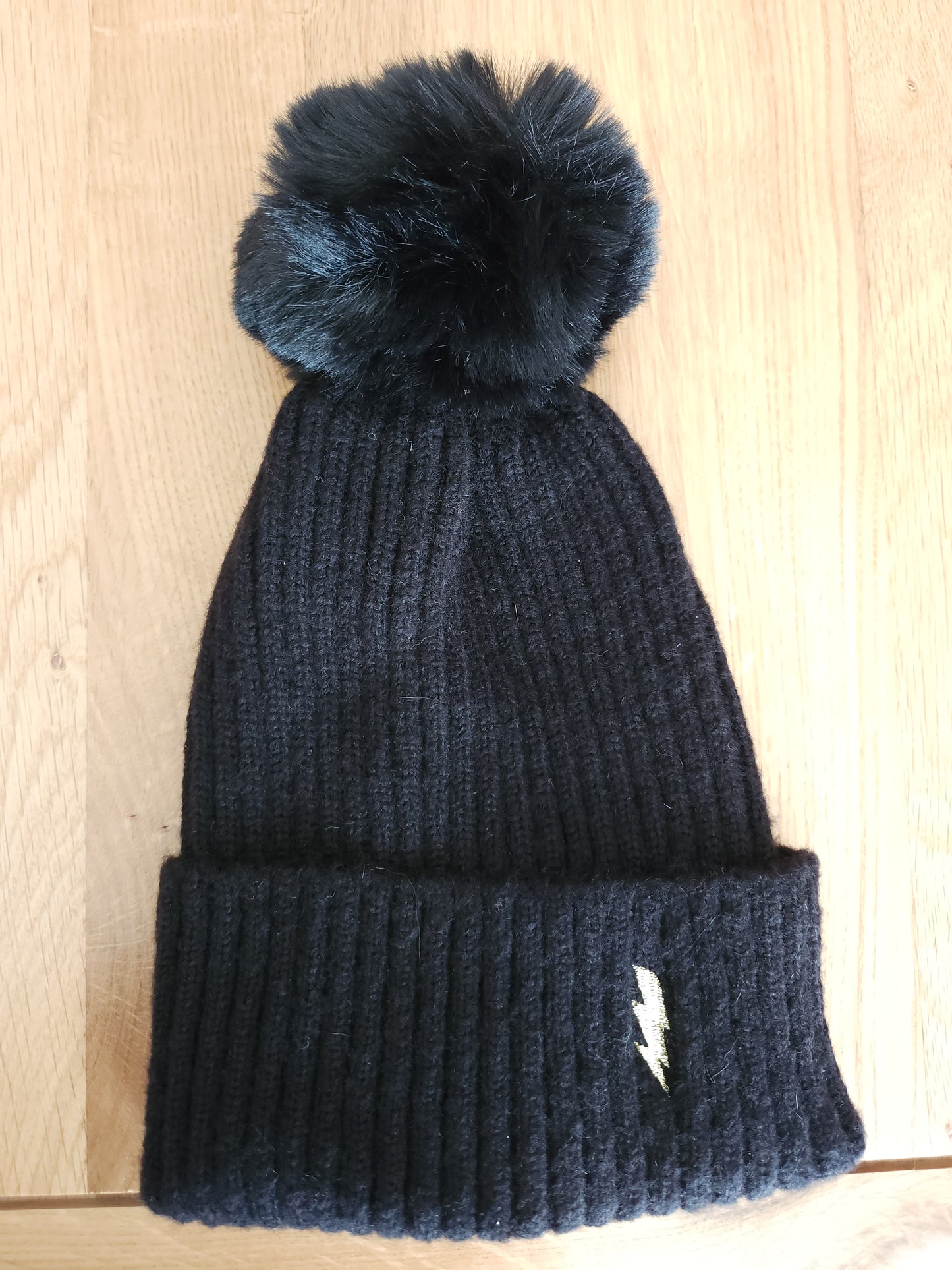 Black with gold bolt bobble hat